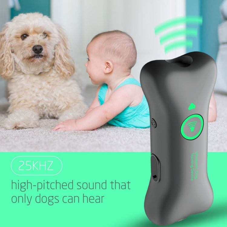 Rechargeable ultrasonic training device with green power icon, dark gray handheld