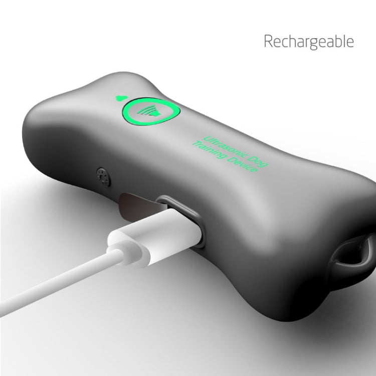 Dark gray rechargeable ultrasonic dog training device with charging port detail