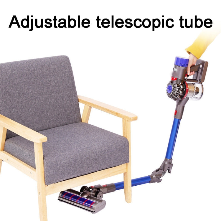 Red foldable extension pipe attached to vacuum, shown in use with furniture