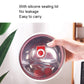 Child holding a colorful stainless steel insulated bowl with clear silicone sealing lid
