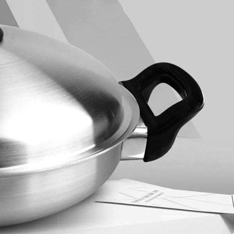 Pot handle ear attached to stock pot, black rubber single-hole grip