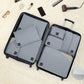 Light blue packing cubes and pouches inside an open travel suitcase