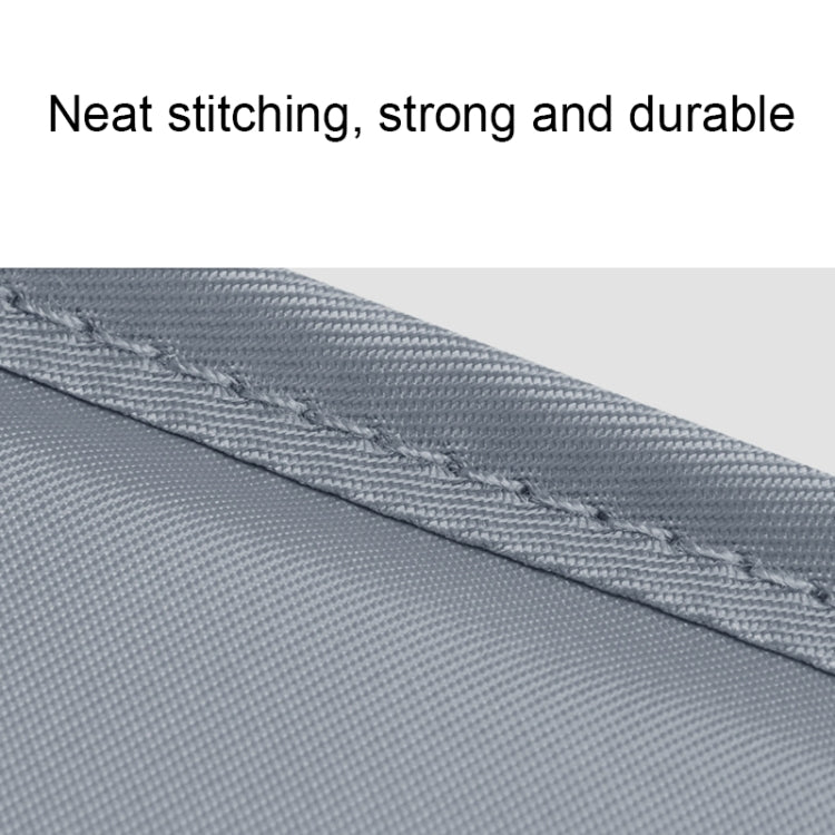 Light blue fabric panel with neat stitched seam on travel storage bag
