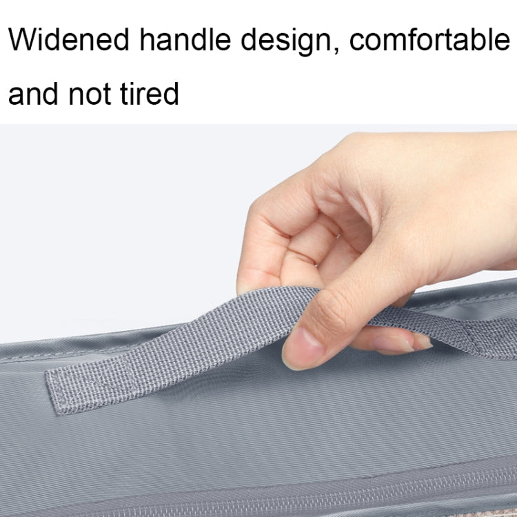Light blue widened carry handle on a zip travel storage bag