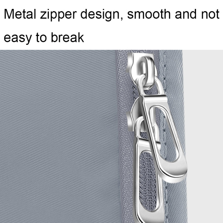 Metal zipper with smooth pull on a light blue travel storage bag