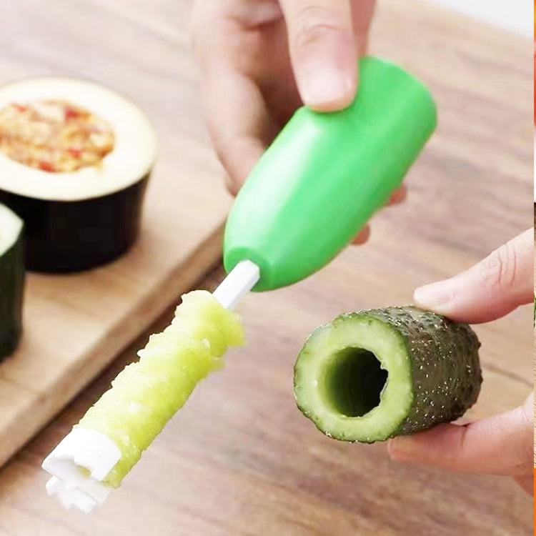 Hands using green core digger to hollow avocado, revealing green center
