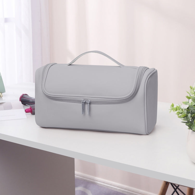 Gray storage bag with top handle and front flap zip closure