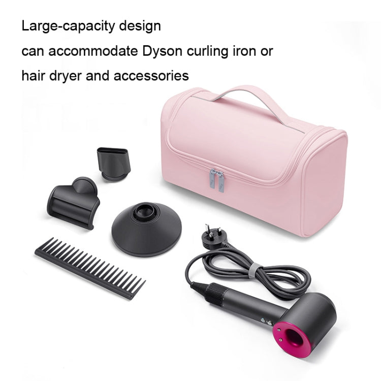 Pink storage bag with included hair tools and accessories laid out