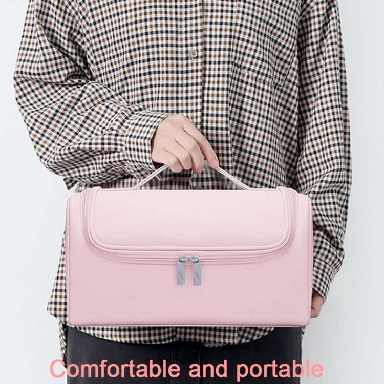 Pink storage bag with front flap and handle for hair dryer accessories