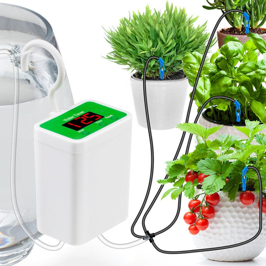 White automatic drip irrigation water timer with green display and black hoses to potted plants