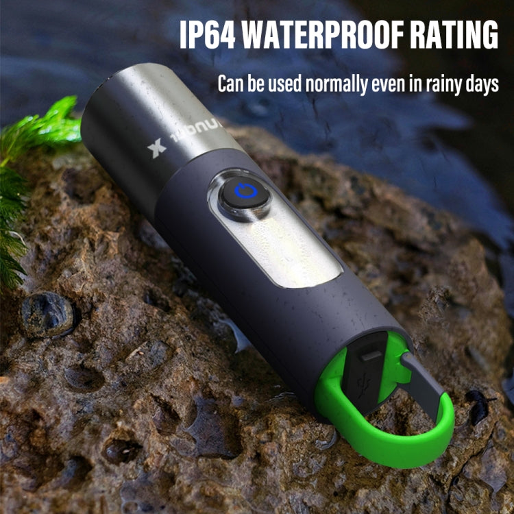 Waterproof LED flashlight with green lanyard ring, lit lens on metal body