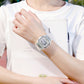 Transparent resin digital sports watch worn on wrist with square LCD face