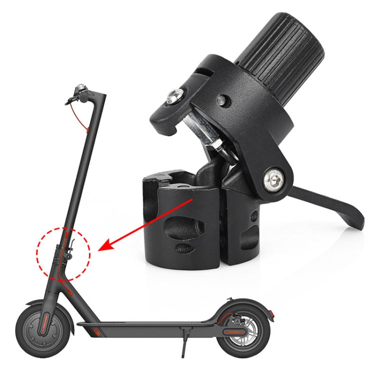 Black scooter accessory clamp mounted on handlebar area with mounting screws