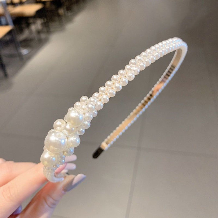 Pearl beaded headband with iridescent pearls, curved band and black comb base