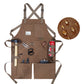 Brown canvas work apron with crossed back straps and front tool pockets