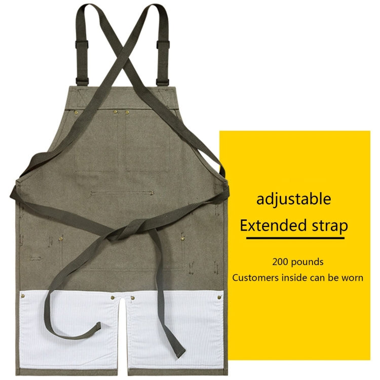 Gray canvas work apron with wide crossed straps and two front pouch pockets
