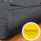 Heavy canvas work apron, dark gray fabric close-up with stitched edge