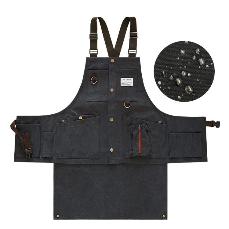 Black canvas tool apron with multi pockets, brass-tone buckles, and tool holders