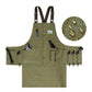 Olive canvas tool apron with multiple pockets, metal D-ring, and adjustable suspenders