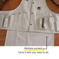 White canvas tool apron close-up with multiple front pockets and a zippered tool sleeve