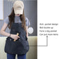 Black canvas tool apron with large front pocket and side tool pouches