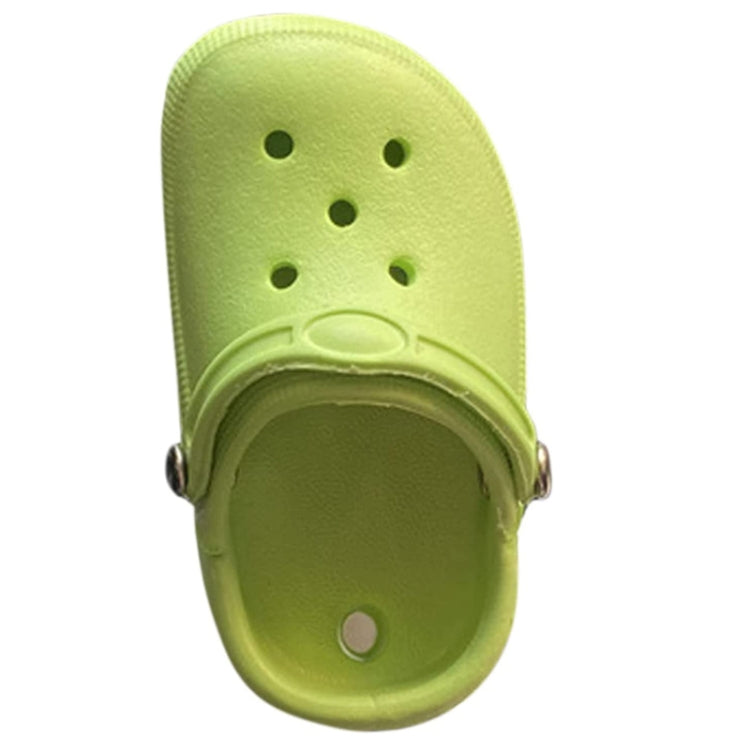 Green shoe-shaped car air vent ornament with perforated top and clip
