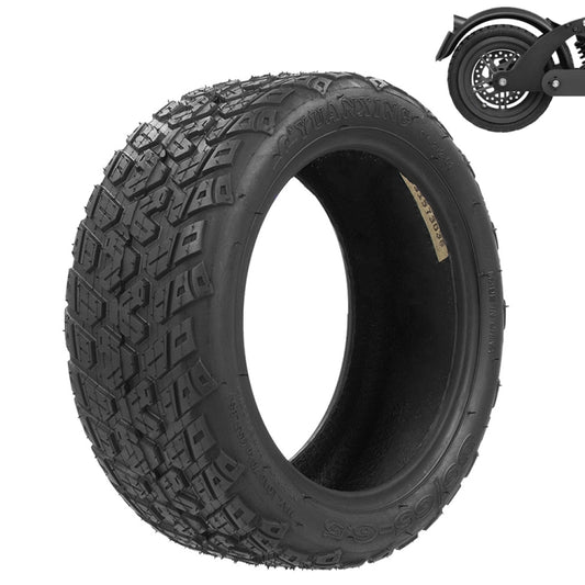 Black scooter tire with chunky tread blocks around the full circumference