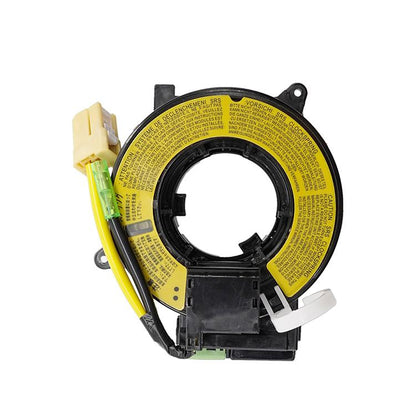 Clock spring coil assembly with yellow label ring and black connector housing