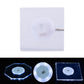 Square transparent LED acrylic coaster with white light and slim crystal base, on/off switch visible.