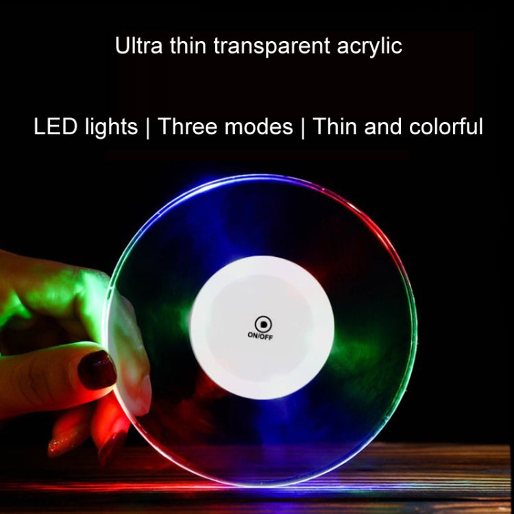 Round transparent LED acrylic coaster with thin rim, multicolor light glow and on/off button.