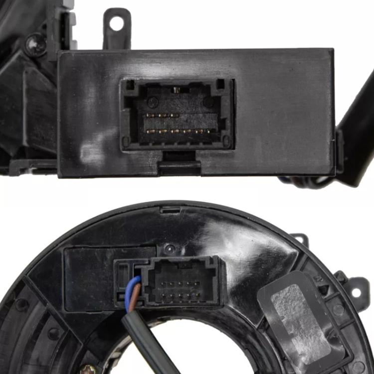 Clock spring coil connector area with exposed wiring and black plastic housing
