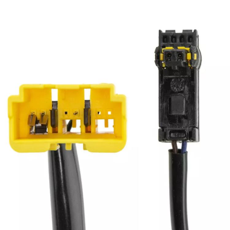 Close-up of clock spring coil terminals with yellow plug and black connector