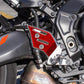 Red carbon-fiber footpad stickers on motorcycle side panel, two-piece set