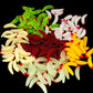 Mixed-color plastic worms with red bead heads, fake fishing bait pile