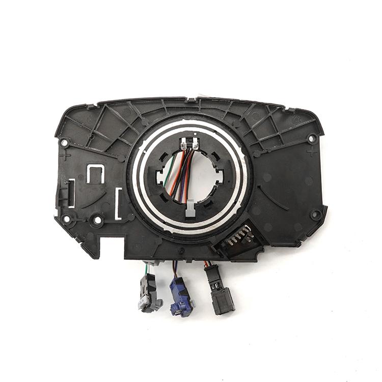 Steering wheel clock spring coil module with central slip ring and contact wires