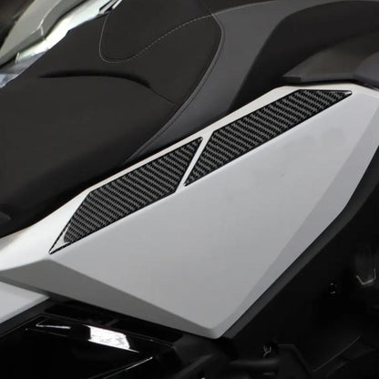 Rear side panel upper protectors installed; black carbon-fiber style panel pieces