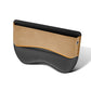 Beige and black car seat gap storage box with orange trim and stitched edges