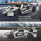 Racing car metal building block toy model with black, silver frame and four spinning wheels