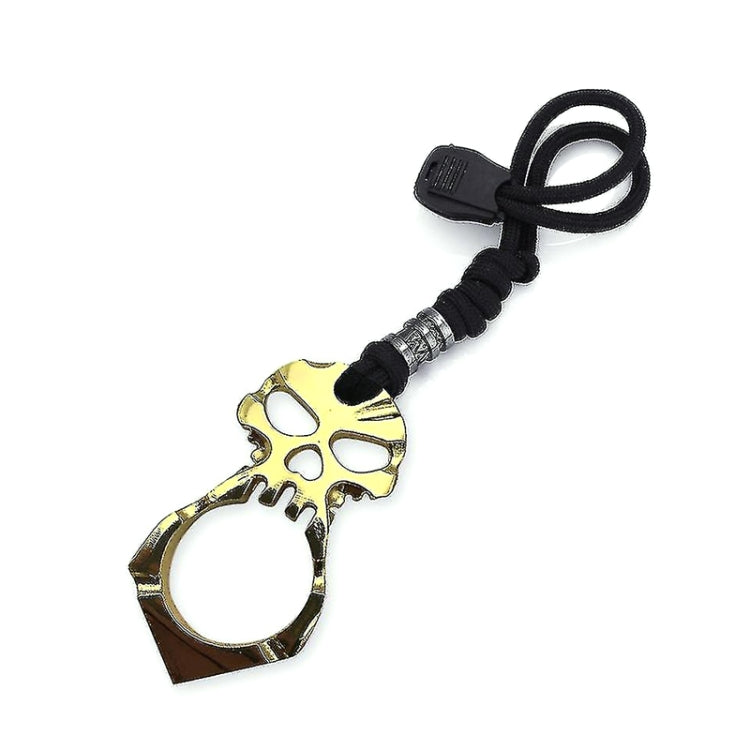 Gold skull self-defense keychain with black rope cord and metal buckle ring