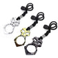 Assorted skull self-defense keychains with black rope cords and metal rings