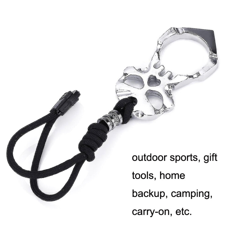 Silver skull keychain with black cord loop and chrome-finished ring
