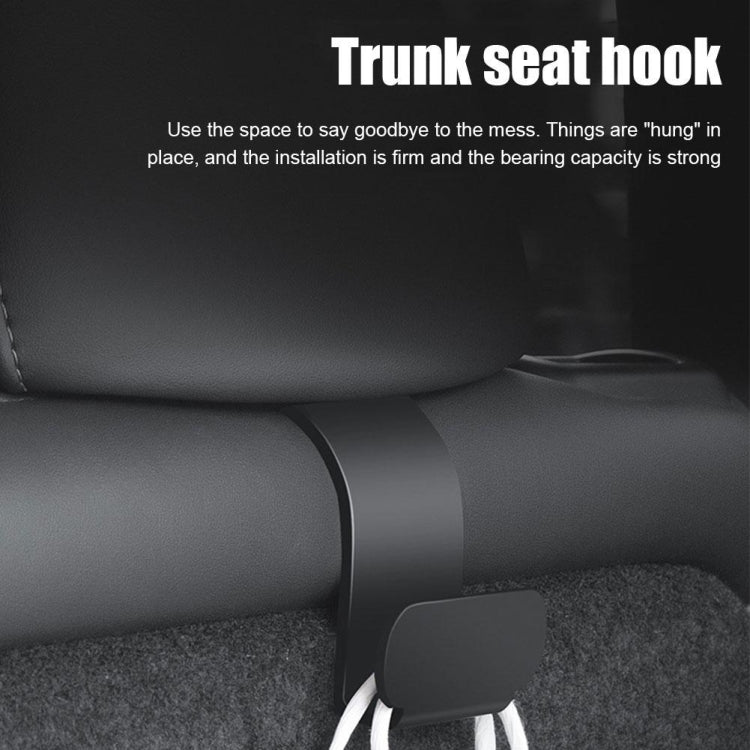 Installed dark gray trunk seat hook with a rope loop hanging from the U-shaped holder