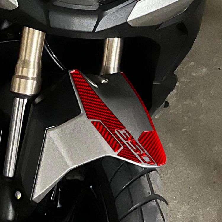 Red carbon fiber front fender protective sticker on scooter fork area