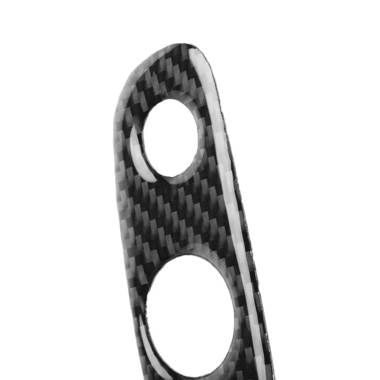 Black carbon-fiber headlight switch sticker trim with two visible cutouts