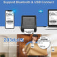 Compact thermal label printer with connected smartphone and laptop on desk