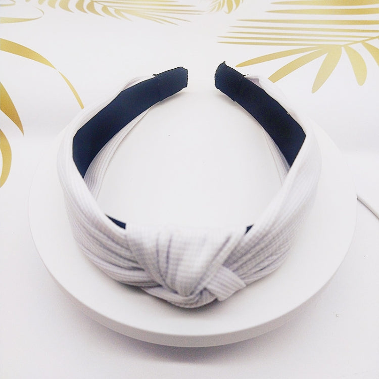 Pressed fabric headband, white with dark navy knotted center and wide band
