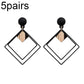 Black alloy drop earrings set with square geometric frames and gold-tone center charm