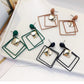 Assorted alloy drop earrings in green, black, and brown with square frame dangles