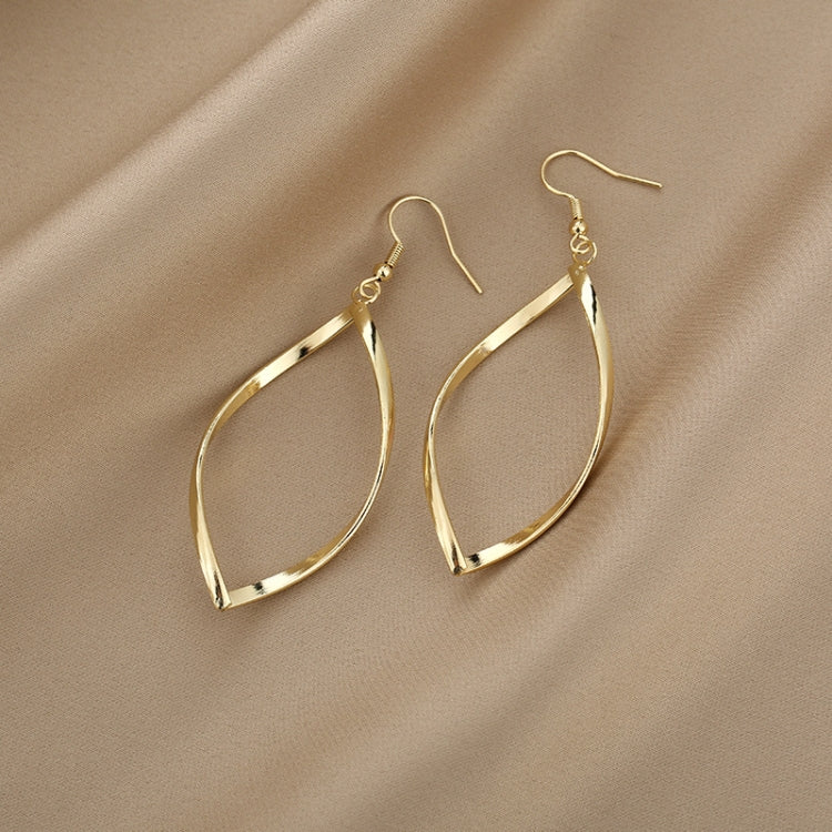 Gold twisted hoop earrings with faceted teardrop profile and fishhook closures