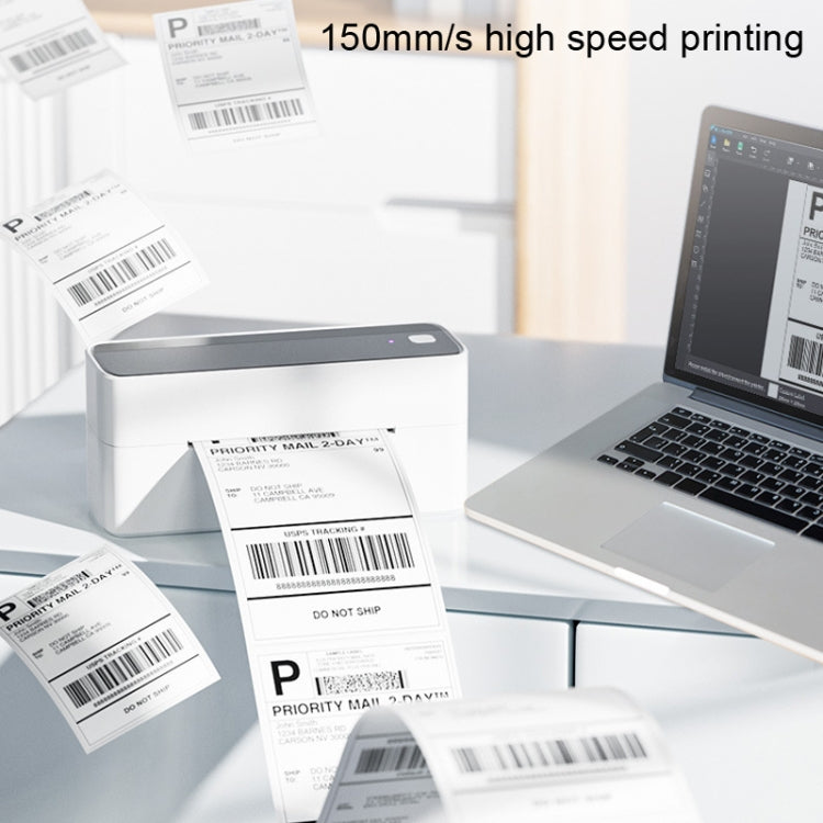 Bluetooth thermal label printer printing shipping labels beside a laptop